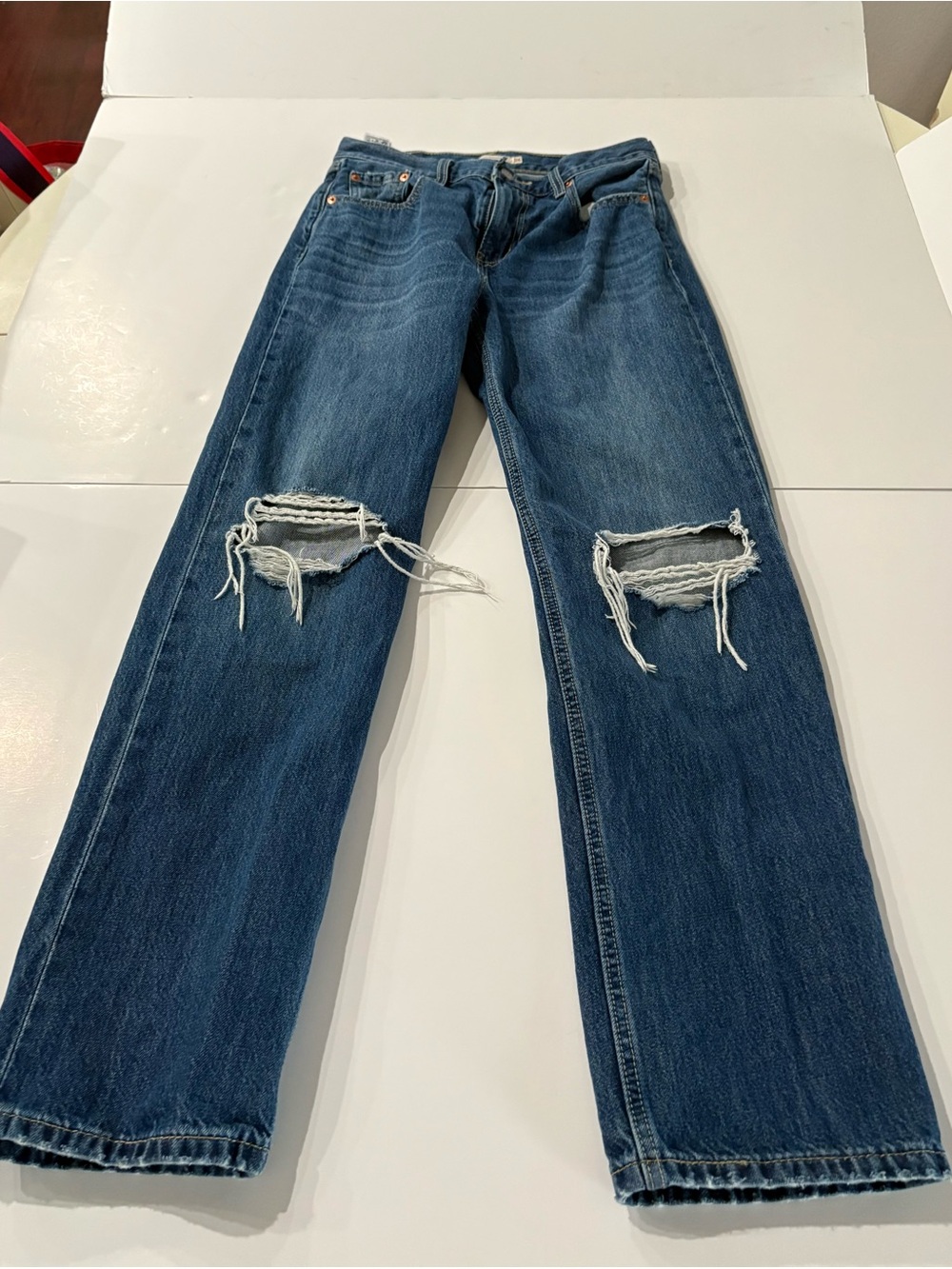 Levi’s women’s Distressed Blue Jeans with holes, low pro straight size 26